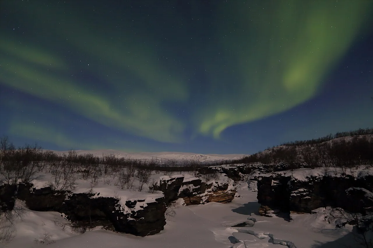 Aurora over frozen Abiskojåkka, Abisko