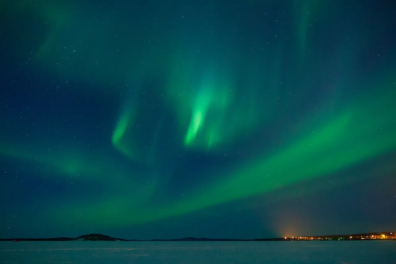 Northern lights gentle rayed bands above Juutuanvuono, Inari, Lapland, Finland, March